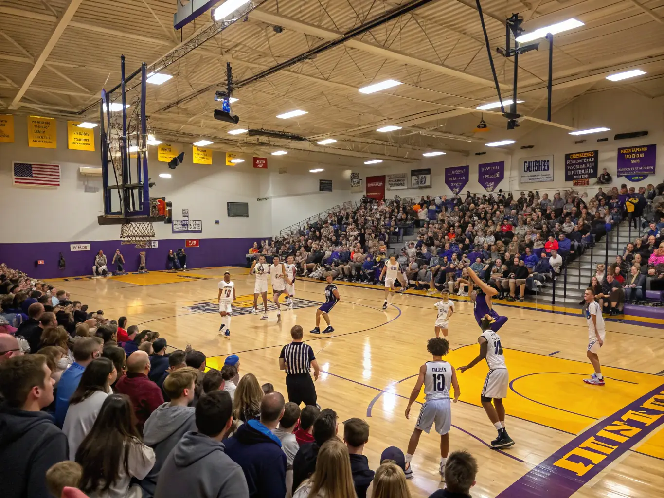 An action shot of basketball players in a gymnasium, showcasing a game in progress with players dribbling, passing, and shooting. The image highlights the fast-paced nature of basketball.